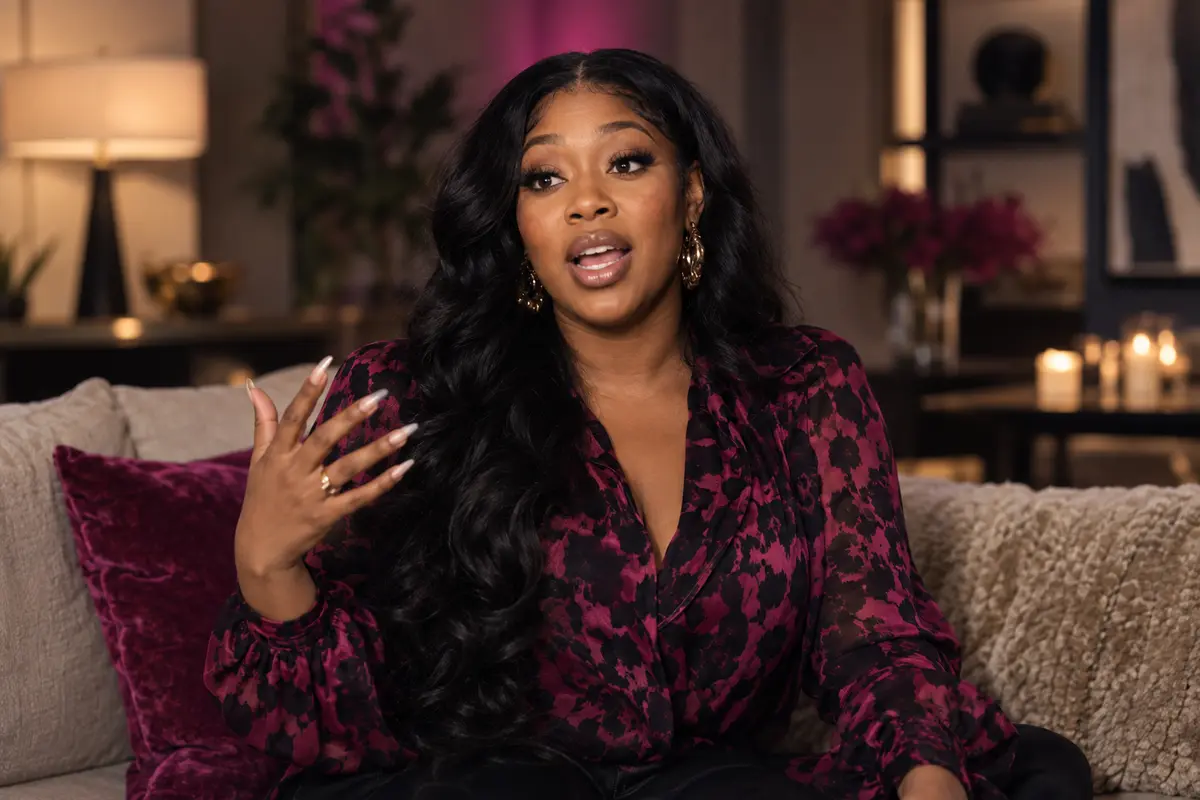Nia, the outspoken ex, seated for a documentary interview